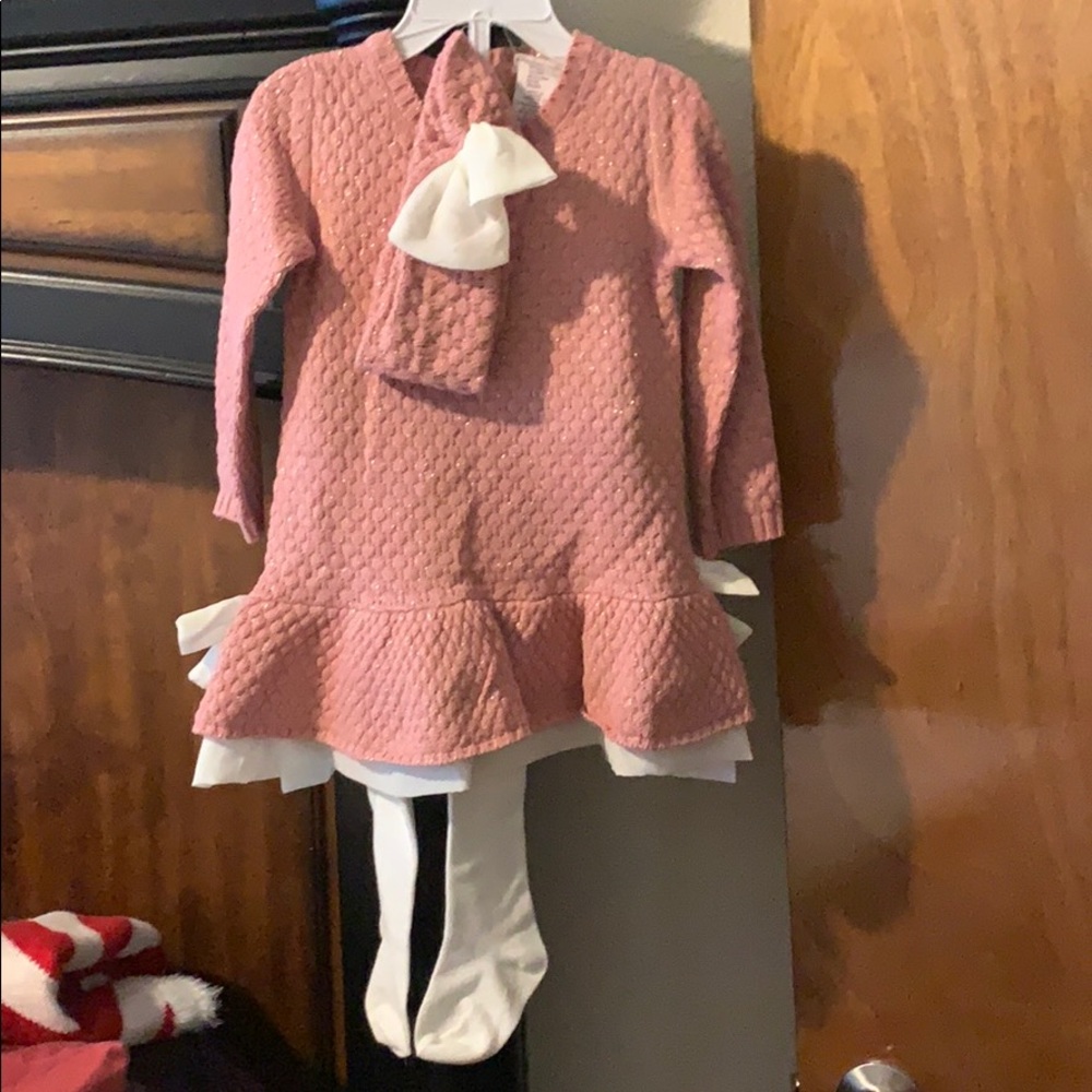 mauve sweater dress with headband and tights.